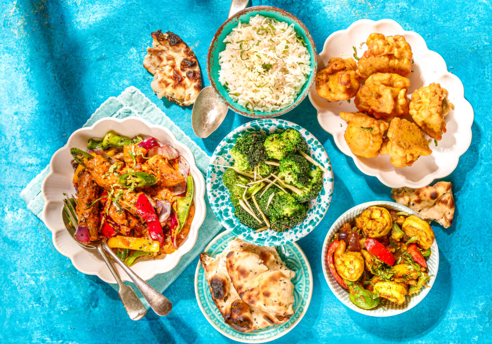 The Thali Sharing Plates Meal Deal. Bombay Shaslik, Sautéed Broccoli, Cauliflower Wings, Goan Prawns, Rice and Naan Bread.